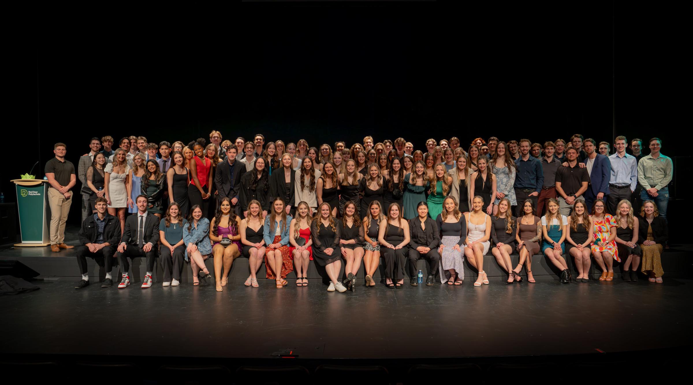 A group shot of RDP athletes on the stage during the Awards Banquet